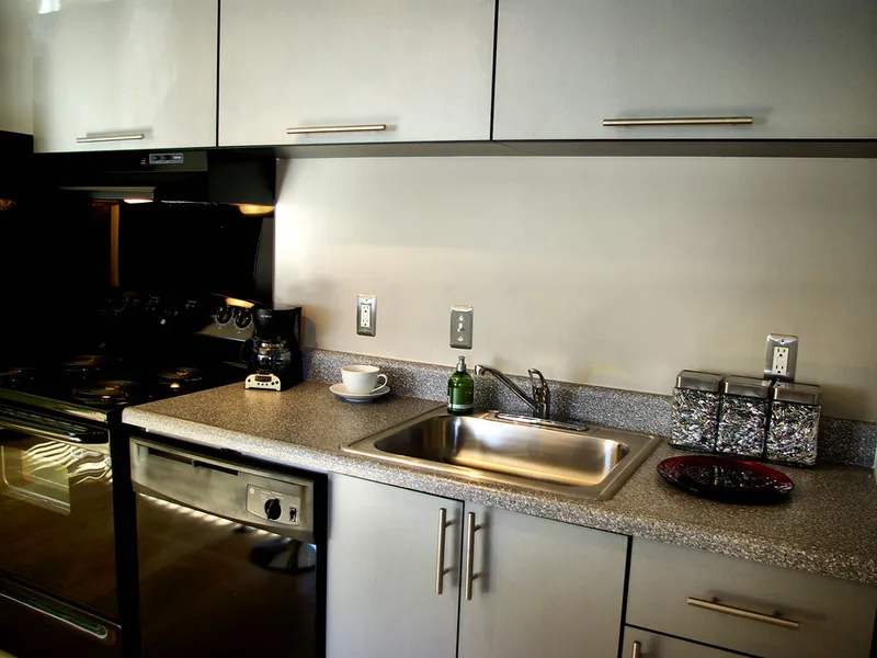 Apartment kitchen with dark counters