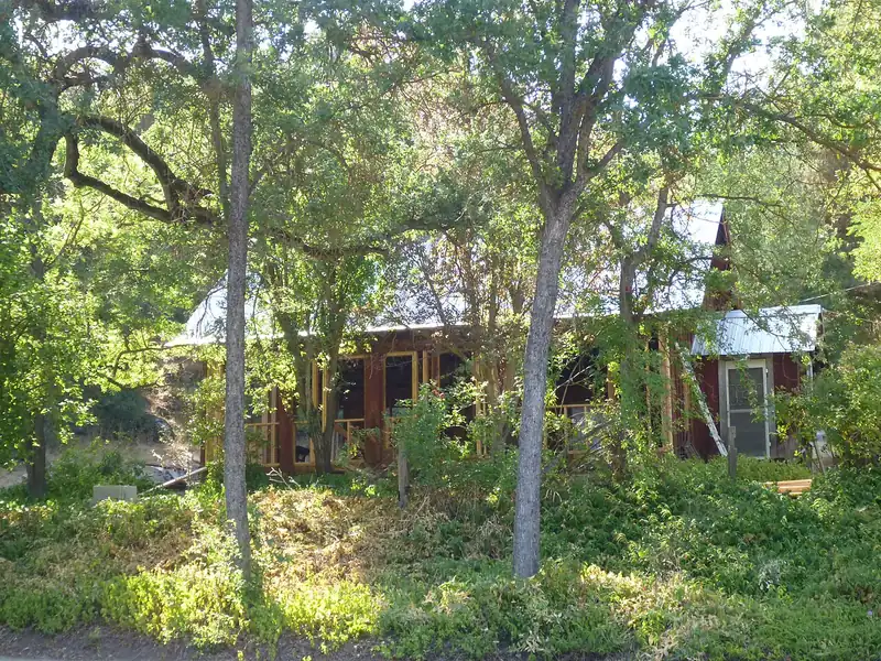Home among green trees in Tulare County