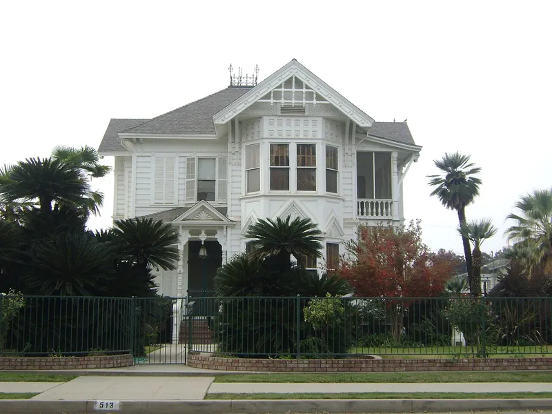 Older home with a shaded yard in Visalia